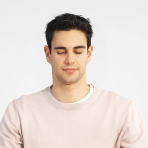 Peaceful beige man meditating cropped