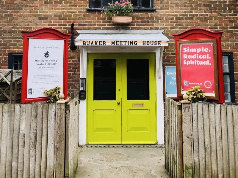 muswell-hill-quaker-meeting-house-entrance-landscape Entrance to Muswell Hill Quaker Meeting House at 77 Church Crescent, N10, with bright yellow double doors under a "Quaker Meeting House" sign