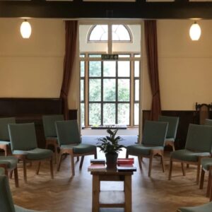 Meeting room at Muswell Hill Quaker Meeting House, with chairs arranged in a circle around a small table, ready for a meditation class
